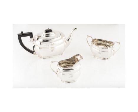 A modern three piece tea serviceS Blanckensee & Son Ltd, Chester 1938, of canted rectangular form, C scroll handles, M engrav