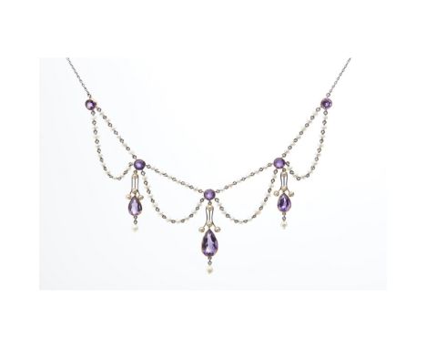 An early 20th century pearl and amethyst set necklacecomposed of seed pearl set swags, set at intervals with round cut amethy