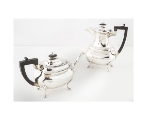 A teapot and matching water potWalker and Hall, Sheffield, of plain rounded rectangular form raised on four short cabriole le