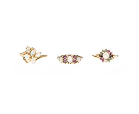 A collection of opal jewelleryto include a 9ct gold opal and ruby set ring, a 9ct opal cluster set ring, a 9ct gold opal, dia