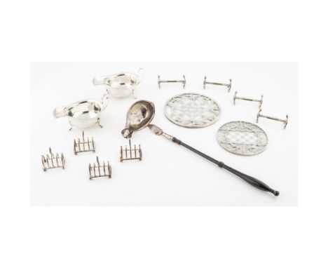 A collection of silverto include: a cased set of four toast racks, a Georgian toddy ladle (a/f), a cased pair of sauce boats,