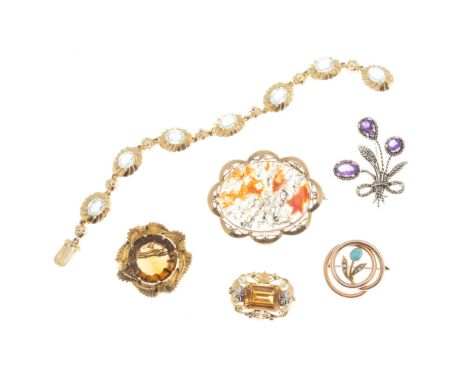 A collection of gem set jewelleryto include a 9ct gold and aquamarine set bracelet, a yellow metal and citrine set brooch, wi