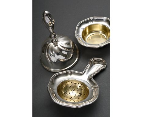 3 Teile Tischglocke (H. 12cm) und Teesieb mit Unterschale (L. 13cm) mit Chippendale Rand, Silber 835, 205g