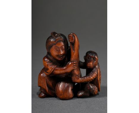 Buchsbaum Netsuke "Frau und Kappa beim Versteckspiel", sign. Tomomasa, sehr seltenes Sujet, 19.Jh., H. 4,4cm, Provenienz: Nor