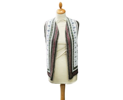 A beaded and decorated long waistcoat, the white beads form a background to the embellishment of the thistle and foliage desi