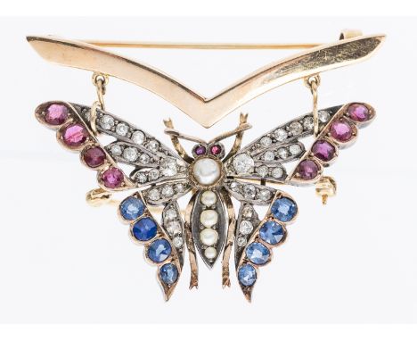 An Edwardian ruby, sapphire, diamond and pearl set 9ct gold metamorphic butterfly brooch, the body set with pearls (assuming 