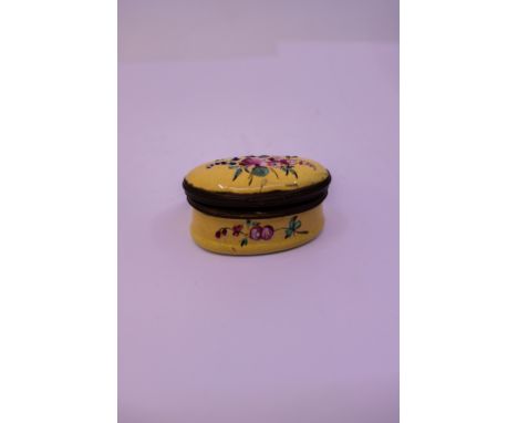 A late 18th Century Birmingham patch box, circa 1775, the yellow ground enamelled with bouquet of flowers, mirror to interior