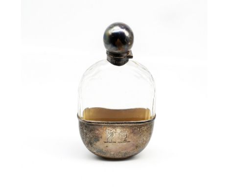 An Edwardian silver mounted oval hip flask, with removable silver cup with gilt interior, the De Winton family crest to side,