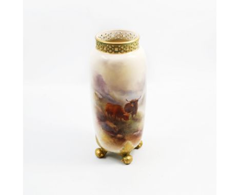 An early 20th Century Royal Worcester vase, shape no: 42 with reticulated collar on four scroll, the body painted with Highla