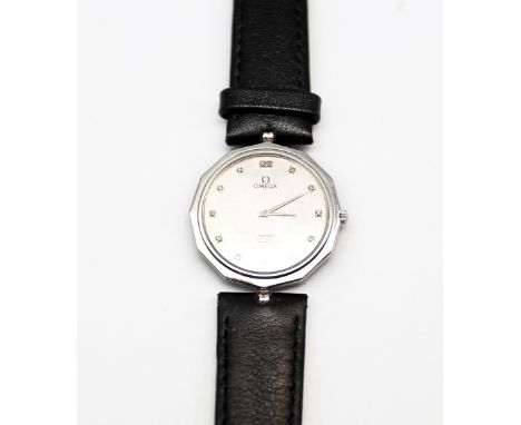 Omega- a ladies vintage platinum and diamond set quartz wristwatch, comprising textured checkerboard dial with diamond set in
