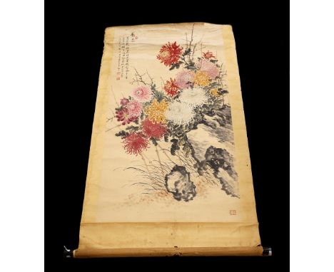 A Chinese scroll painting of chrysanthemums, early 20th century, with extensive inscription and seal mark, approx. 127cm x 65