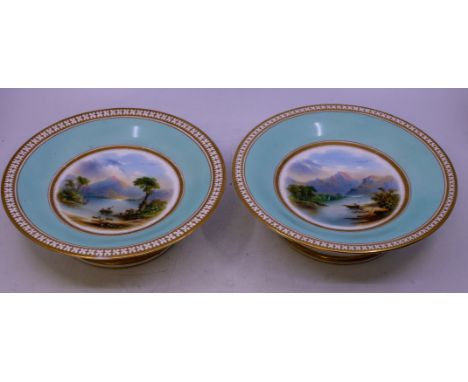 A 19th Century dessert service comprising two tazza / comports and five plates, turquoise borders with chain link gilt border