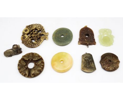 A group of nine Chinese jade and jade type pendants, plaques and objects, all 20th century, including a Han dynasty style sea