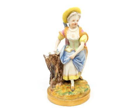 A Royal Worcester spill vase modelled as an 18th Century young lady in straw hat with pink bodice, blue skirt, pink cape besi