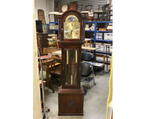 Longcase clock with brass dial, applied foliate scroll corner pieces, moon face, black Roman numerals and fancy poker hands, 