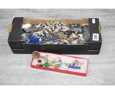 Costume jewellery to include brooches, necklaces, bracelets, bangles, a vesta case, a white metal trinket box etc