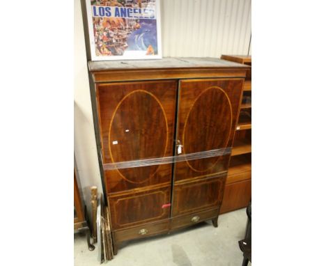 George III Mahogany Inlaid Clothes Press / Wardrobe, Two Doors opening to reveal hanging space above Two Drawers, raised on s