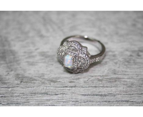 A Silver and CZ dress ring with central Opal panel