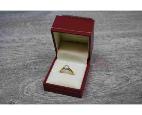 A diamond solitaire 18ct yellow gold ring, the round brilliant cut eight claw set diamond weighing stated weight 0.50 carat, 