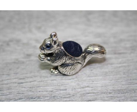 A Sterling Silver Squirrel pincushion with Emerald Eyes