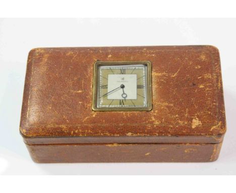 A mid 20th century leather cigarette box with integral clock to lid