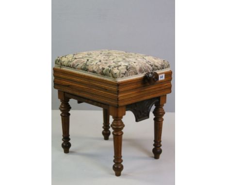 Tapestry topped rise and fall piano stool, turned legs and cast metal brackets with shell decoration