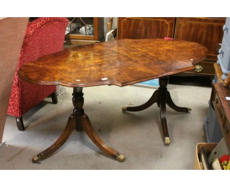 DIning table with Chippendale border, two pedestal legs with gilt paw casters, dimensions approximately 76cm x 170cm x 92cm