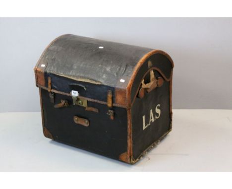 Dome topped canvas and leather travel trunk, the initials L.A.S to each side, leather straps, brass lock fittings, the interi