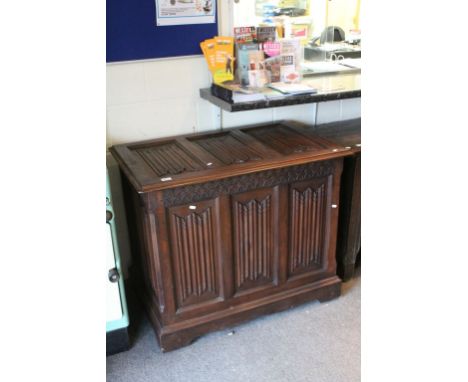 Large Oak Coffer with Linenfold Carving, the hinged lid opening to reveal a later interior shelf, 99cms x 65cms x  84cms high