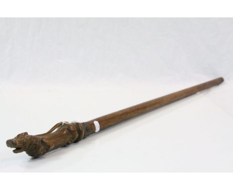 A antique walking stick with carved passant lion handle  