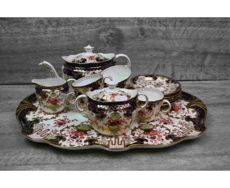 Early 20th century Royal Crown Derby Imari matched part tea service comprising teapot, sugar bowl, milk jug, five tea cups an