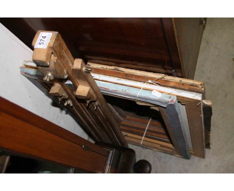 A Vintage artist painting easel together with a quantity of oil painting stretchers 