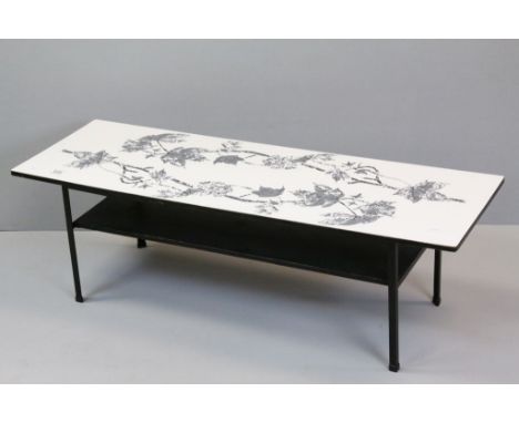 Retro coffee table with printed leaf decoration, magazine shelf below, black angular legs, height approximately 36cm