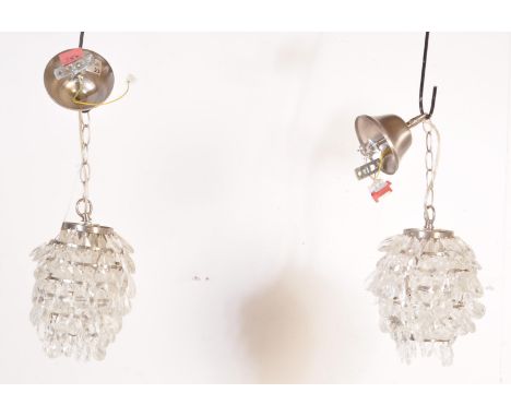 A pair of contemporary globular pendant light shades by Heals of London having faceted glass droplets throughout. Pendant sha