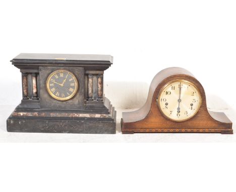 A circa 1900 early 20th century slate and marble eight day mantel clock of architectural from having a stepped flared top ove