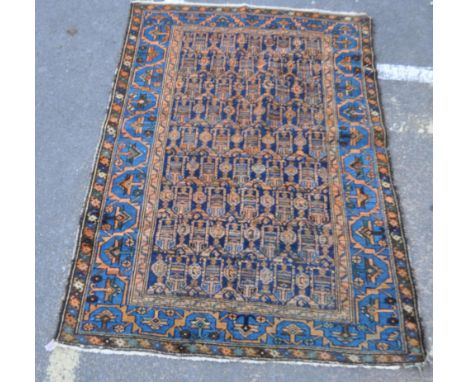 A mid 20th century hand knotted wool on cotton Persian Islamic Malayer carpet rug. The rug having yellow / mustard geometrica