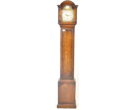 An early 20th Century Edwardian 8 day longcase Grandmother clock (smaller Grandfather clock) having a brass ornate face with 