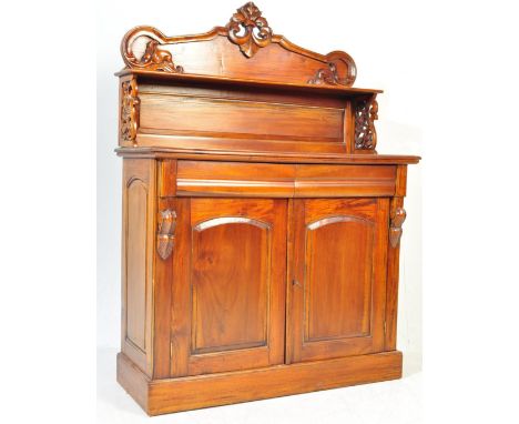 A late 20th century Victorian Revival mahogany chiffonier having a carved gallery back with pierced crest over two short draw