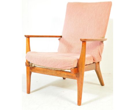 A mid 20th century easy chair / armchair by Parker Knoll. The chair having pink upholstered backrest and seat, curved armrest