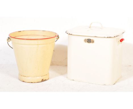 A retro vintage mid 20th century enamel bread bin having a red handles to the side and lift off lid with handle to the top. S