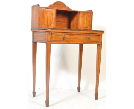 A late 19th century satinwood ladies writing desk&nbsp; / Bonheur Du Jour. Raised on square tapering legs with fitted frieze 