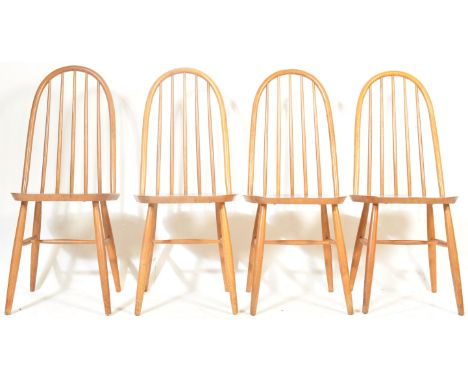 A set of four retro vintage mid 20th century Ercol / Quaker style chairs having a hooped backrest, saddle seat raised on turn