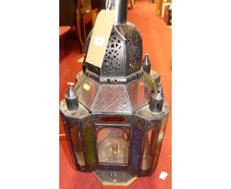A painted metal lantern, of square section with coloured glass panes, fitted for electricity, w.29cm, h.61cm 