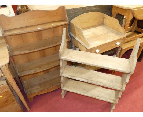 A rustic pine four-tier open waterfall bookshelf, w.67cm; together with a further pine three-tier wall shelf (2) 