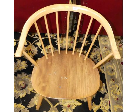 An Ercol blond elm model 449A stickback tub elbow chair (reduced in height), w.54.5cm 