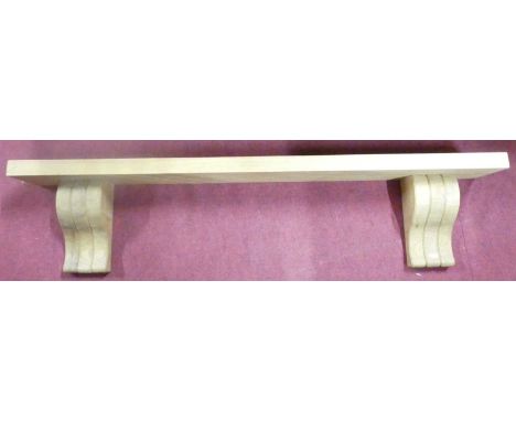 A contemporary well-made blond oak single wall shelf, having slightly shaped supports, length 137.5cm, d.17cm