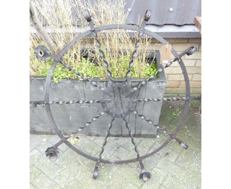 A spiral turned wrought iron hanging ceiling light, fitted with candle sconces (majority missing) dia. 111cm