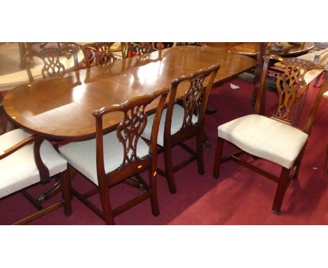 Titchmarsh &amp; Goodwin - a mahogany and crossbanded dining suite, comprising Regency style twin pillar dining table, with s