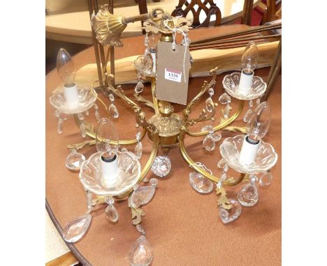A floral gilt metal hanging five-light electrolier, with integral ceiling rose