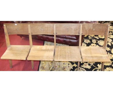 An early 20th century light oak four-seater folding chapel bench, length 188cm